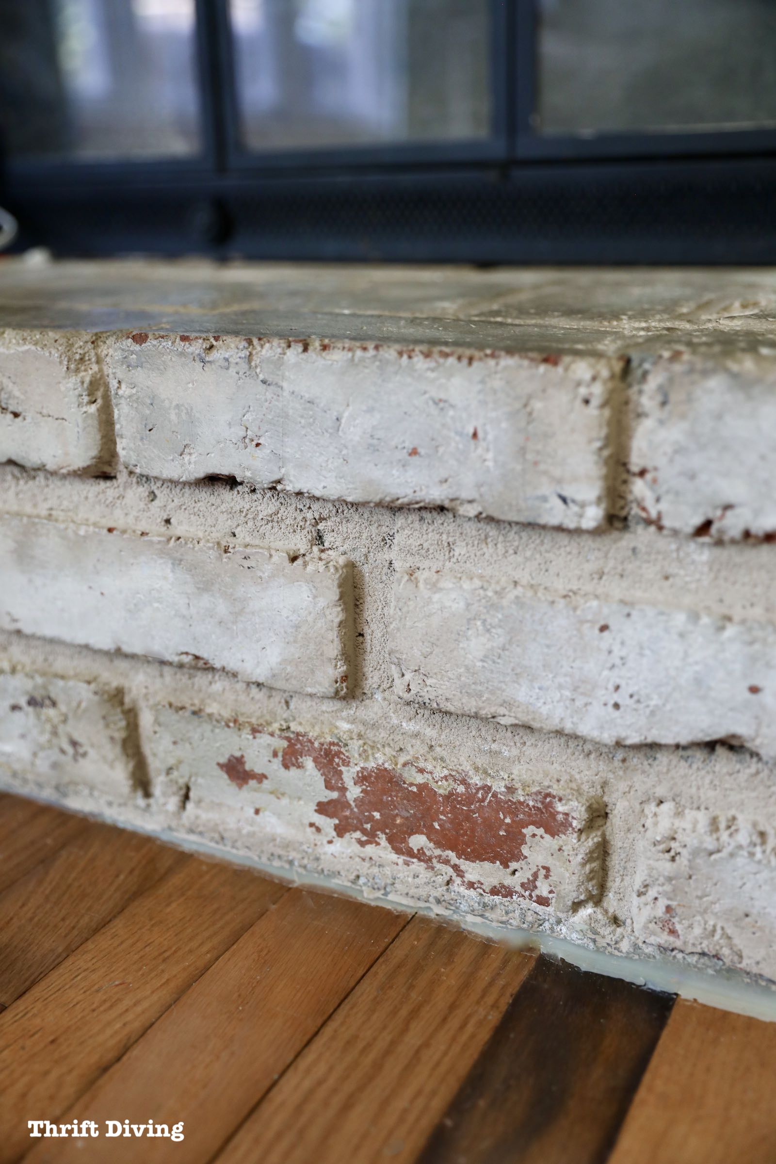 How to Paint a Brick Fireplace - 7 years later it's still holding up with very little chipping - Thrift Diving