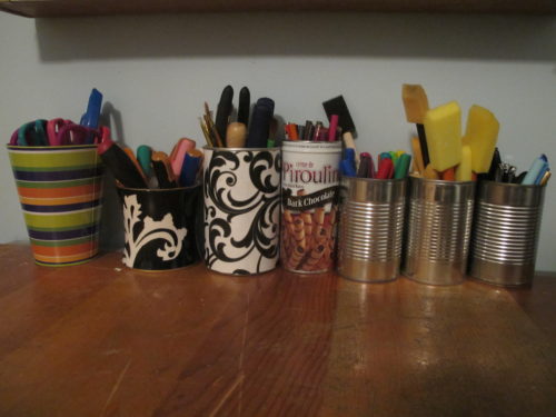 Tips for pulling together a craft room - Store craft supplies in tin cans. - Thrift Diving