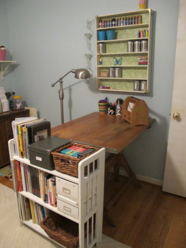 Tips for pulling together a craft room - Place a crafting table perpendicular to the wall. - Thrift Diving