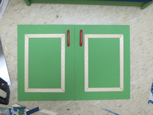 Wooden Play Kitchen Makeover - Add trim to flat panel doors for a decorative look. - Thrift Diving