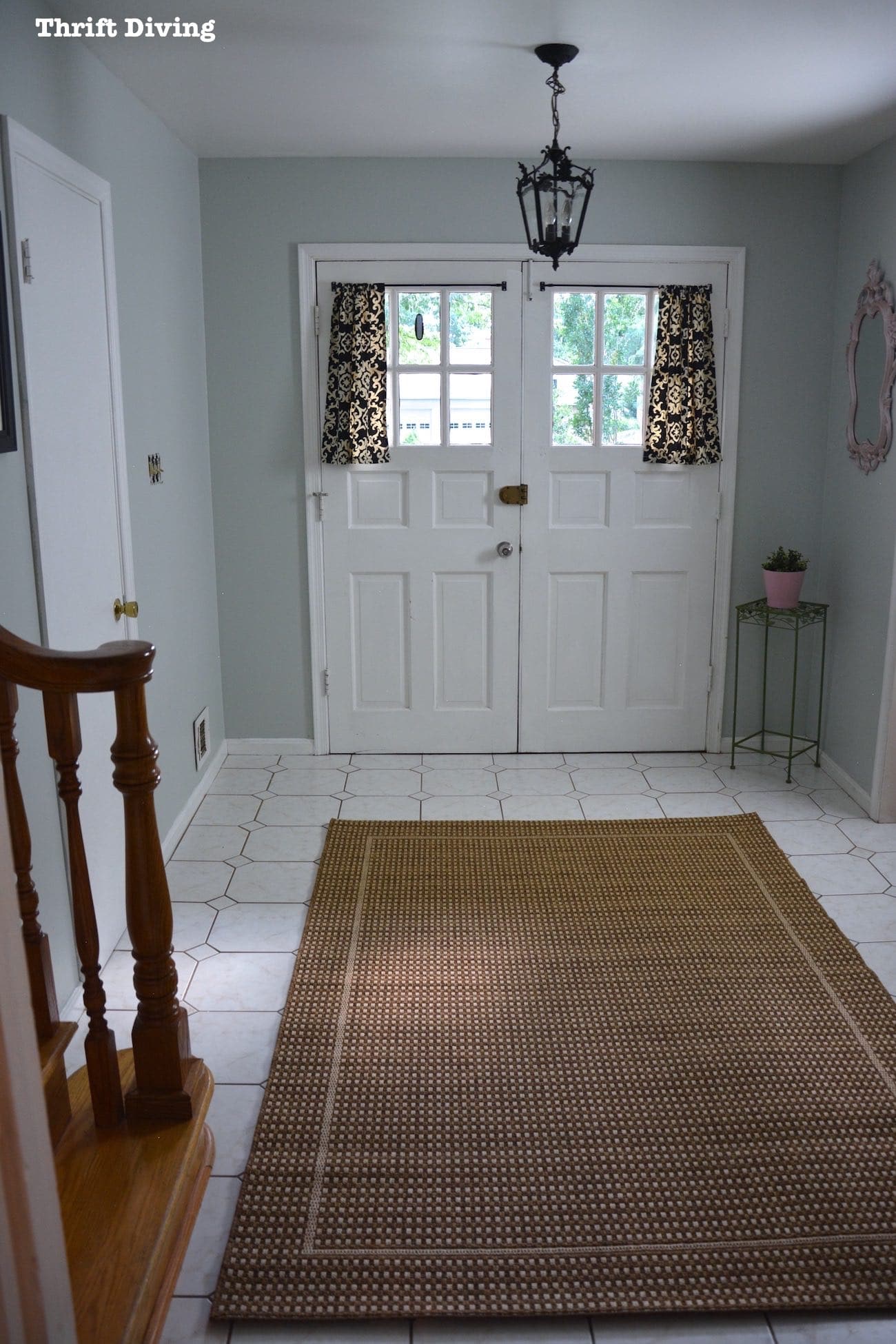 Sherwin Williams Sea Salt and Rainwashed - Sea Salt paint color in a foyer with white doors. - AFTER - Thrift Diving