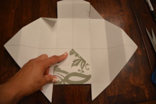 How to Make a Gift Box From Scrapbook Paper - Snip both sides of the folds up to the edge of the corner. - Thrift Diving