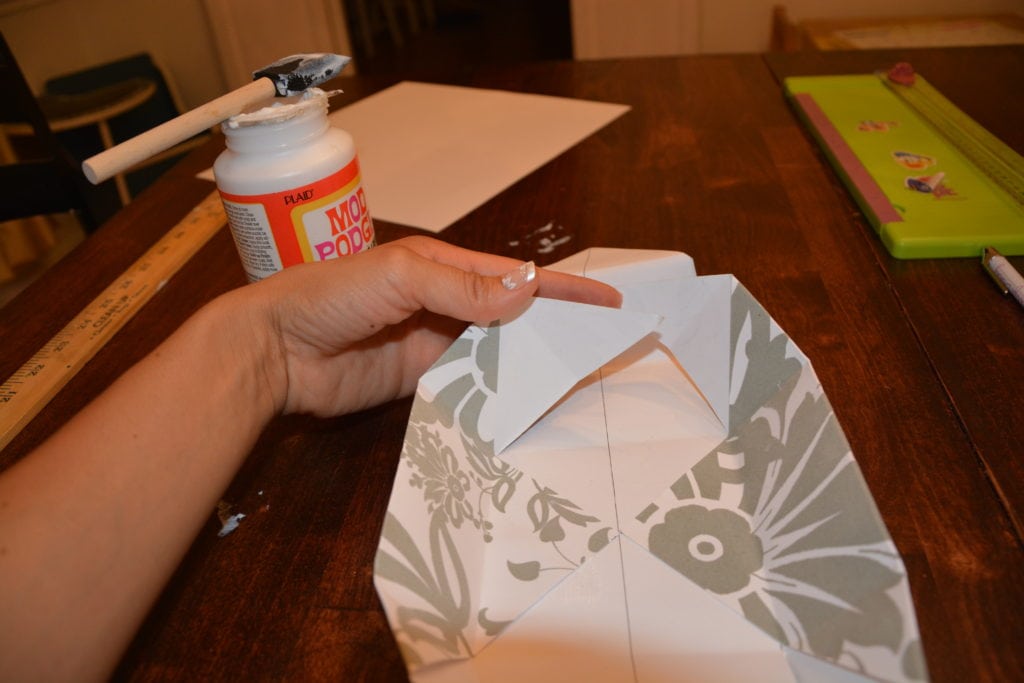 How to Make a Gift Box From Scrapbook Paper - Glue down the center pieces. - Thrift Diving