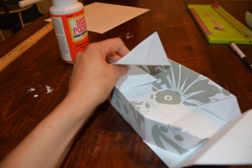 How to Make a Gift Box From Scrapbook Paper - Wrap the flaps over the edge to create the sides of the boxes. - Thrift Diving