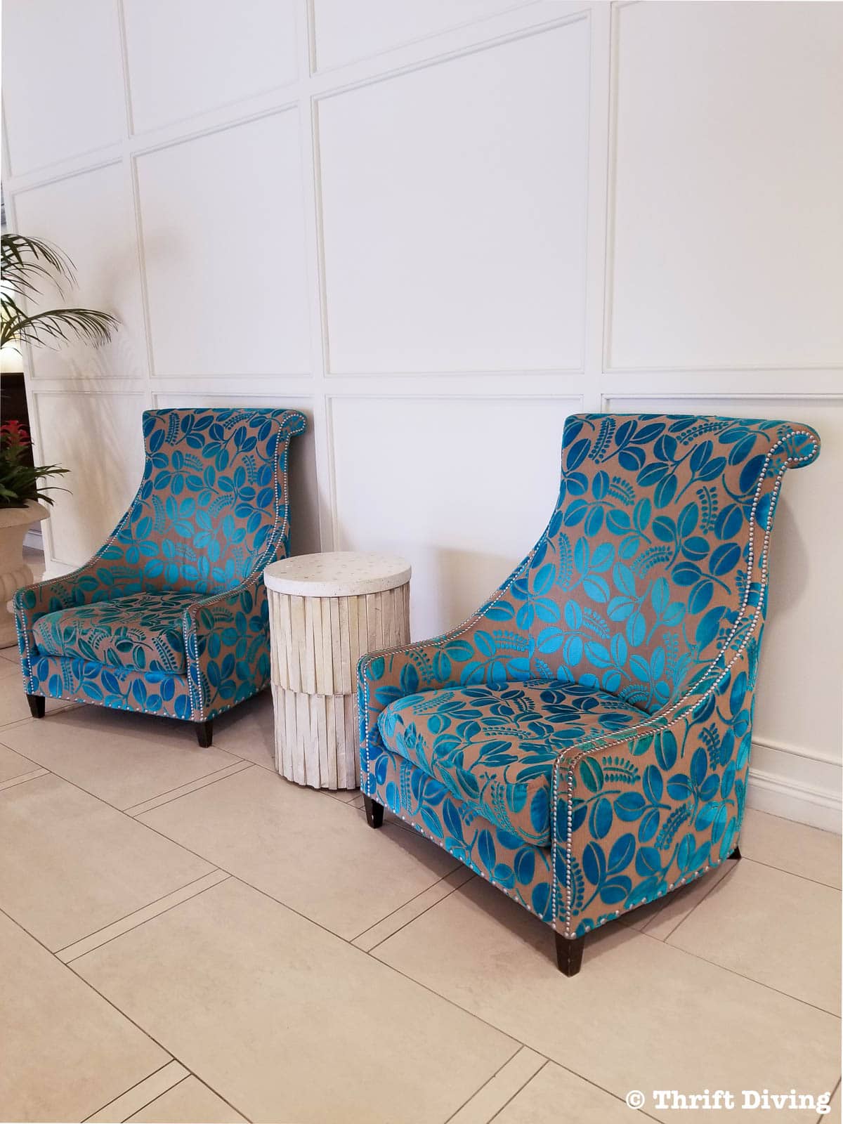 Pretty upholstered teal chairs in hotel lobby - Thrift Diving