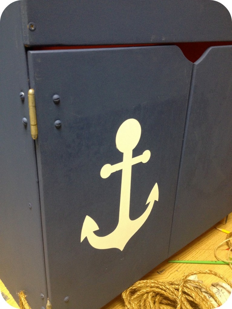 Wooden play kitchen makeover from the thrift store - Stenciled anchor on furniture. - Thrift Diving