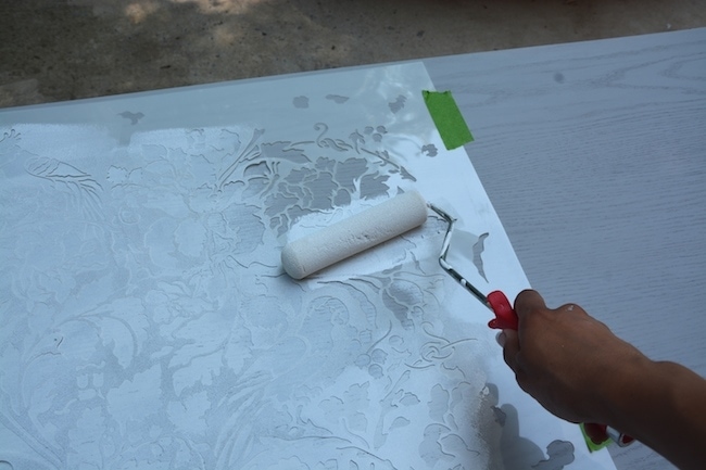 How to cut a table in half - Use a decorative floral stencil to paint the table. - Thrift Diving