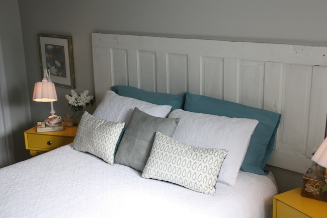 Guest Bedroom Makeover - Doors can be turned sideways and mounted for headboards, such as in this guest bedroom makeover - AFTER - Thrift Diving