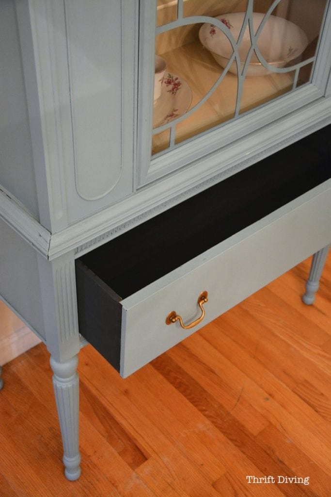 China Cabinet Makeover - Nantucket blue painted china cabinet with gold pulls and a black drawer. - Thrift Diving