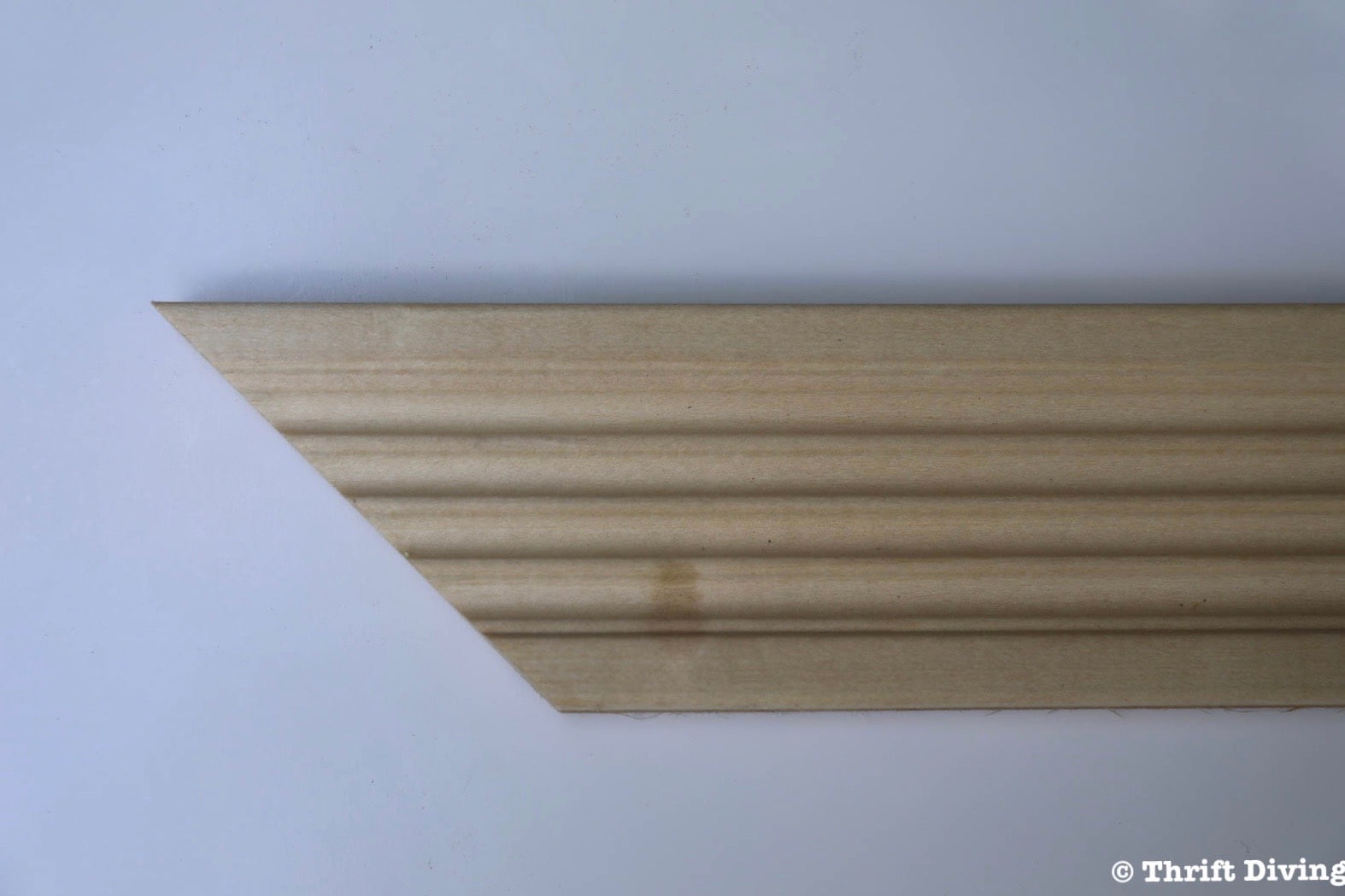 How to Make a Big DIY Whiteboard - Cut the trim at 45 degree angles. - Thrift Diving