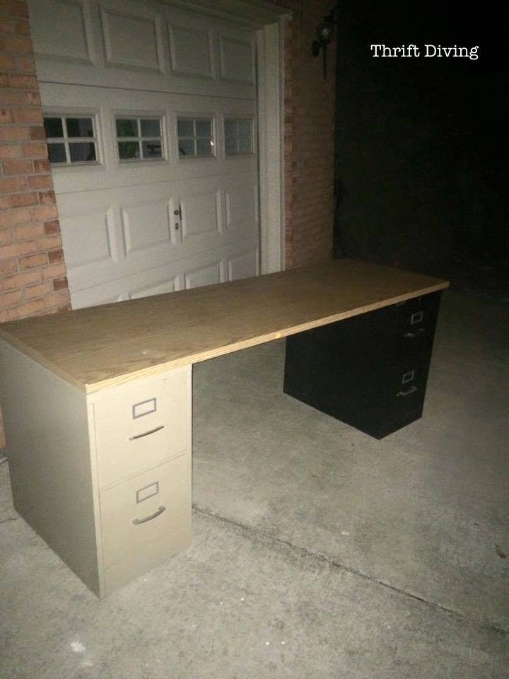 Basement Office Makeover - Use two file cabinets and an old door or countertop to create a large basement office desk. - Thrift Diving