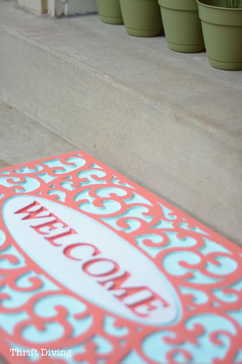 How to Paint a Rubber Custom Welcome Mat - AFTER: Pretty painted welcome mat with Coral and Turquoise spray paint. - Thrift Diving 