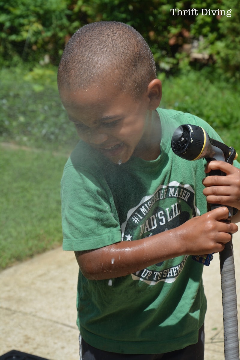 My son spraying himself.