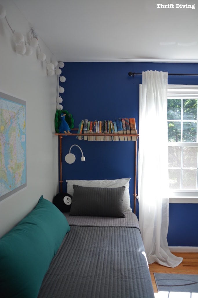 Tween Boys Blue Bedroom Makeover - Turn a boys room into a cozy bedroom using Behr Mosaic Glue, IKEA curtains and bedding, and a copper piping bookshelf | Thrift Diving