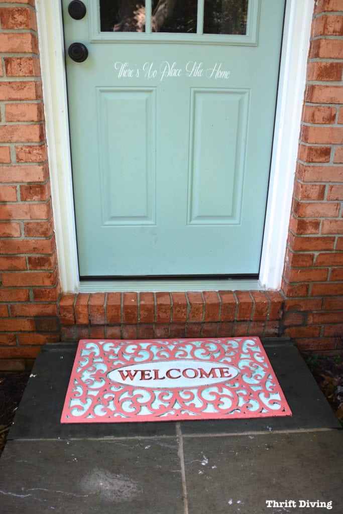 Painted welcome mat is still looking good after years outdoors. - Thrift Diving