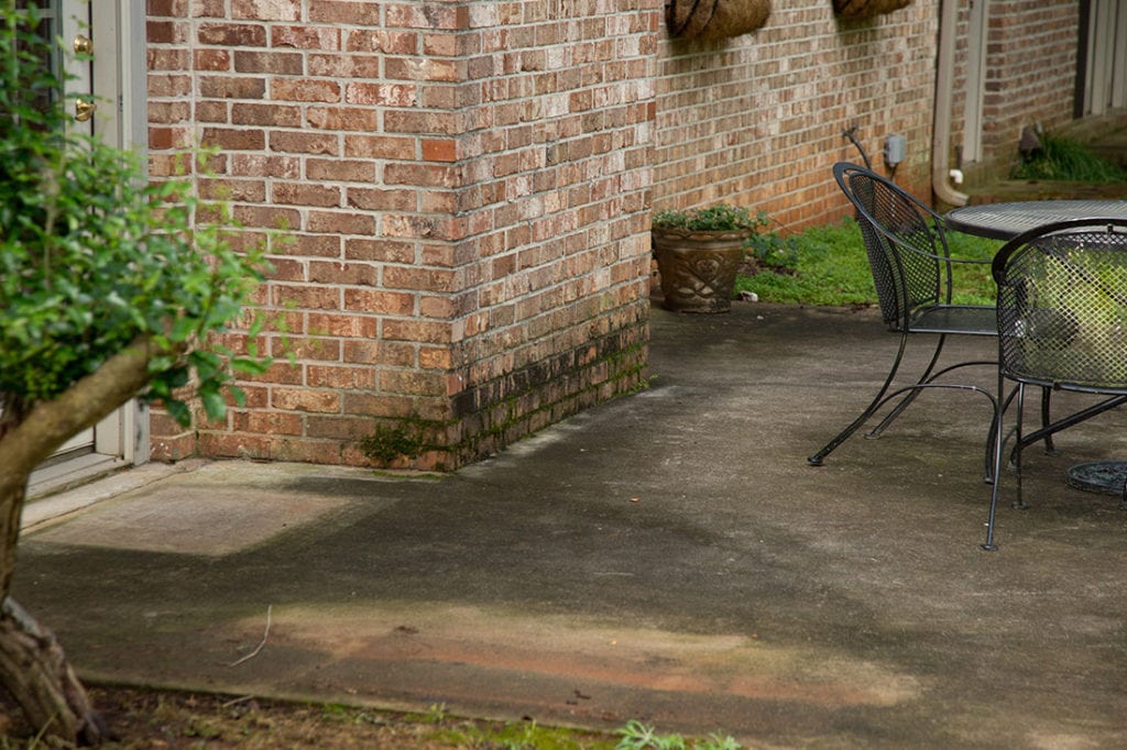 How to Deep Clean With a Pressure Washer - Dirty patio needs pressure washing. - Thrift Diving