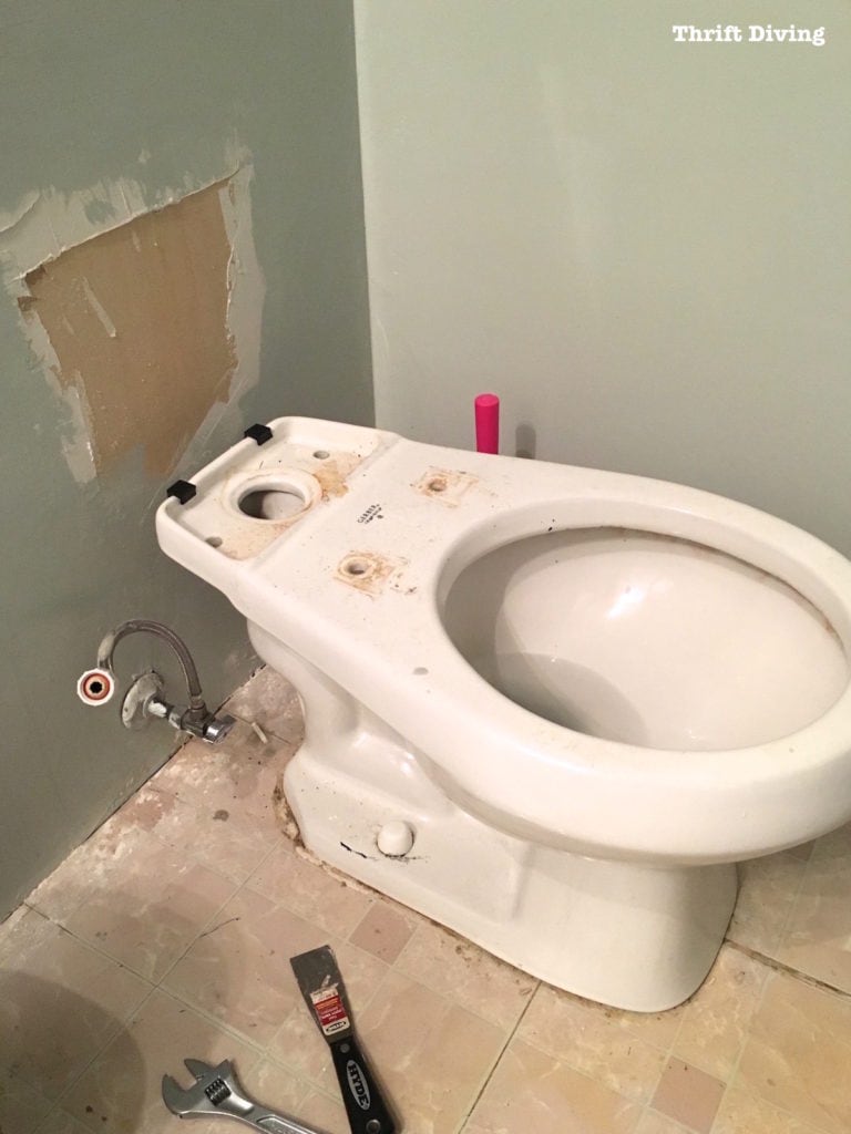 How to Remove a Toilet - Remove the back tank. - Thrift Diving