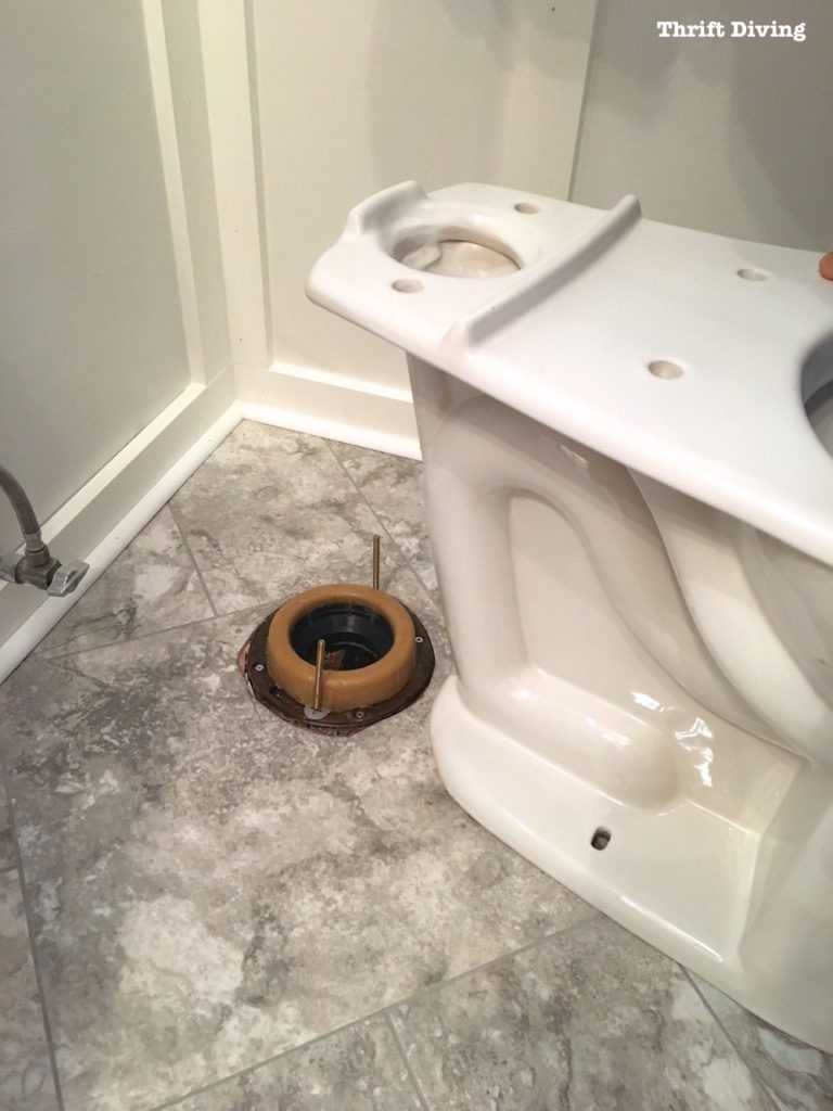 How to install a toilet yourself. Stop paying for plumbers - With the wax ring in place, sit the toilet on top. - Thrift Diving