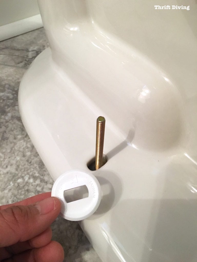 How to install a toilet yourself. Stop paying for plumbers - Place the plastic ring over the bolt. - Thrift Diving