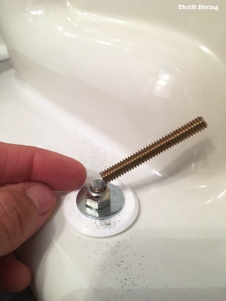 How to install a toilet yourself. Stop paying for plumbers - Toilet bolts are soft; trim them with a hacksaw. - Thrift Diving