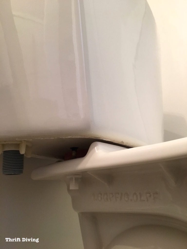 How to install a toilet yourself. Stop paying for plumbers - Tighten the tank bolt to the bowl with plastic nut. - Thrift Diving