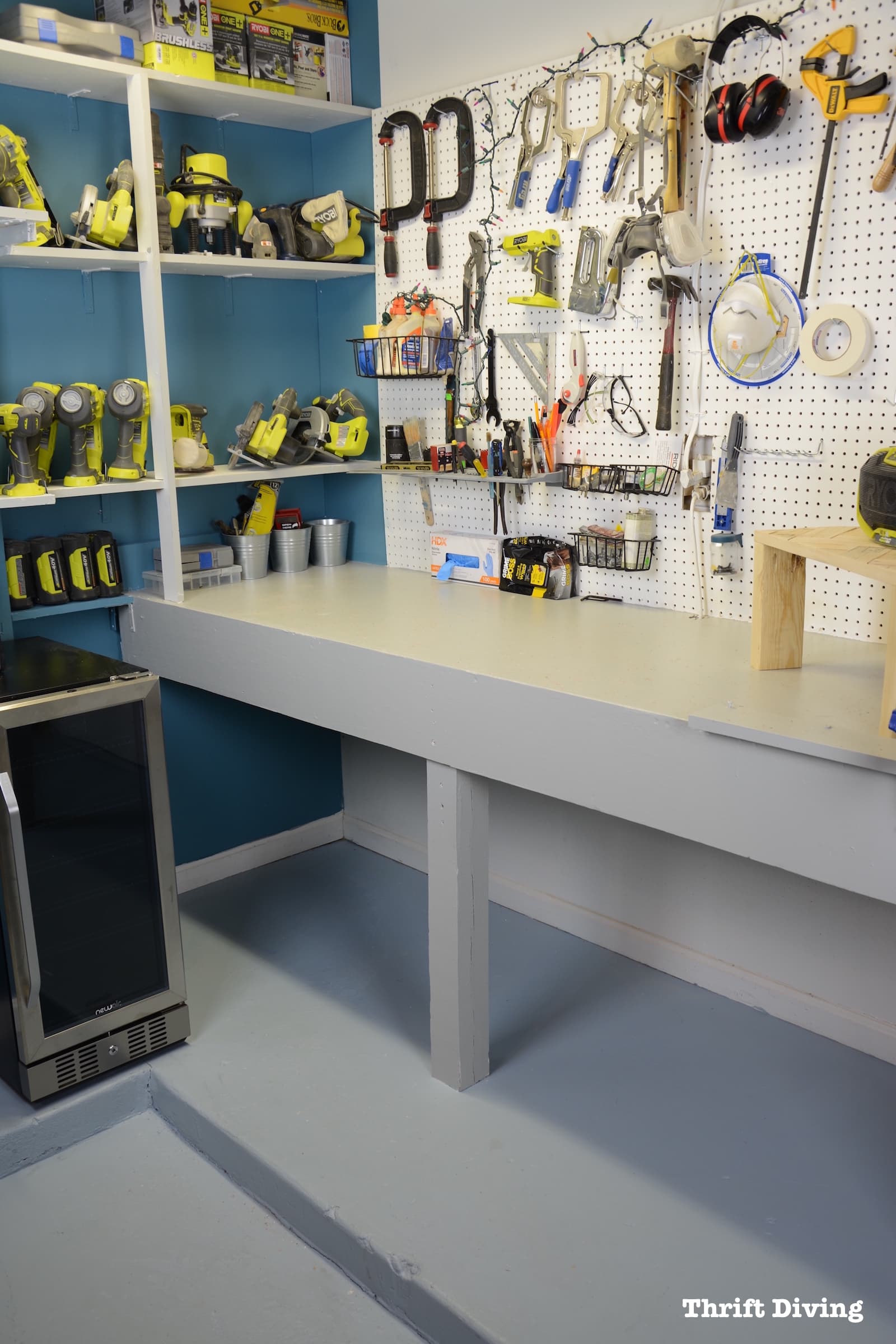 Workbench paint makeover with Beyond Paint - How to Paint a Workbench Using Beyond Paint - Gray workbench, teal accent wall, white pegboard. - Thrift Diving