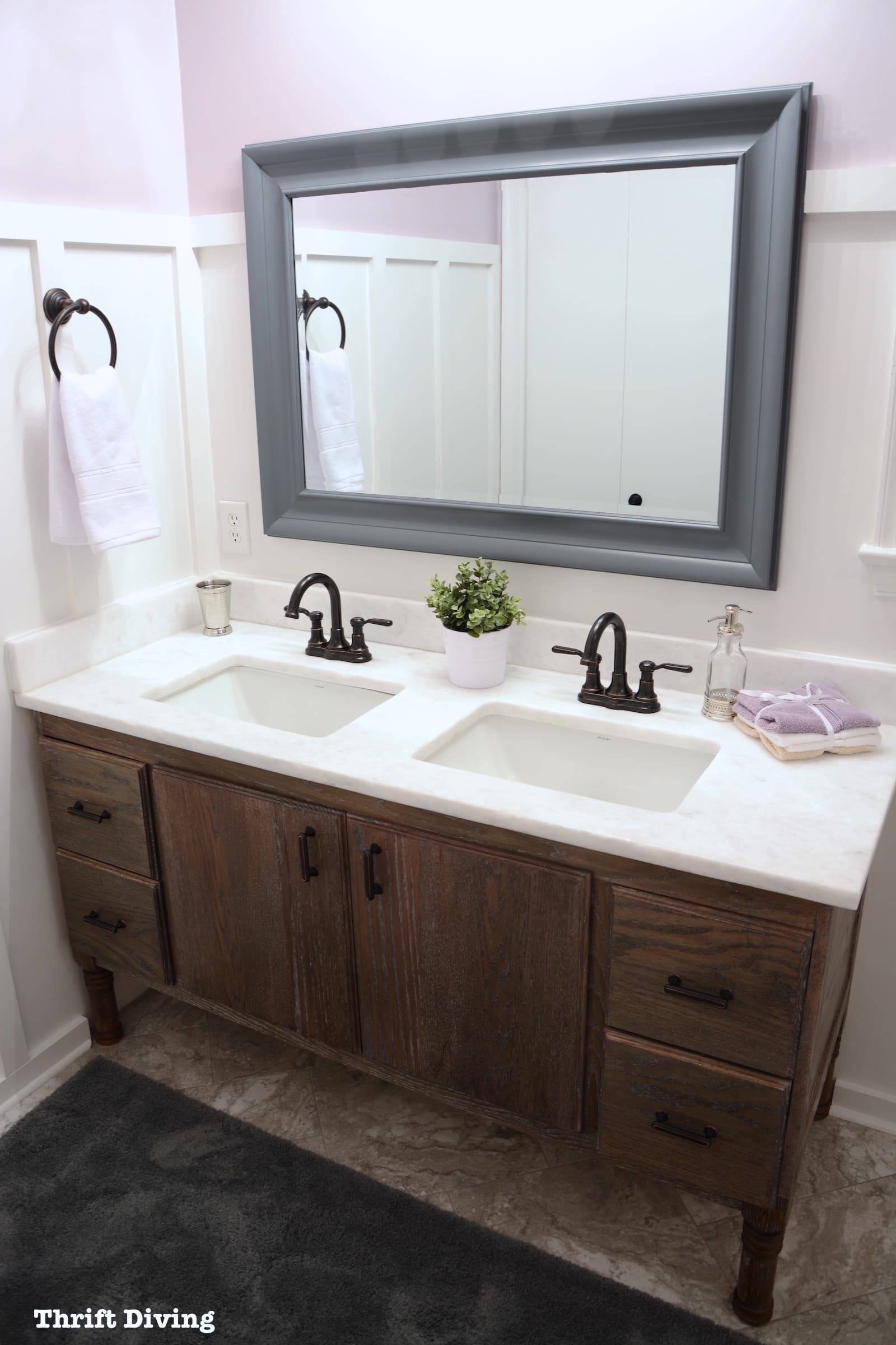 Pretty lavender bathroom makeover with a DIY bathroom vanity and lavender paint. - Thrift Diving