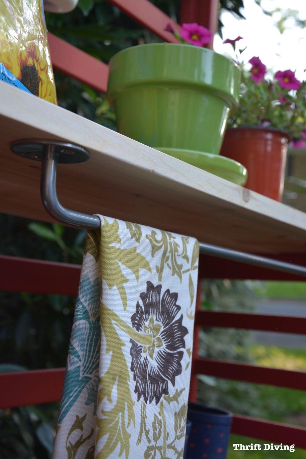 Repurposed toddler bed: What to do with an old toddler bed - Turn a toddler bed into a garden bench and add a towel bar. - Thrift Diving