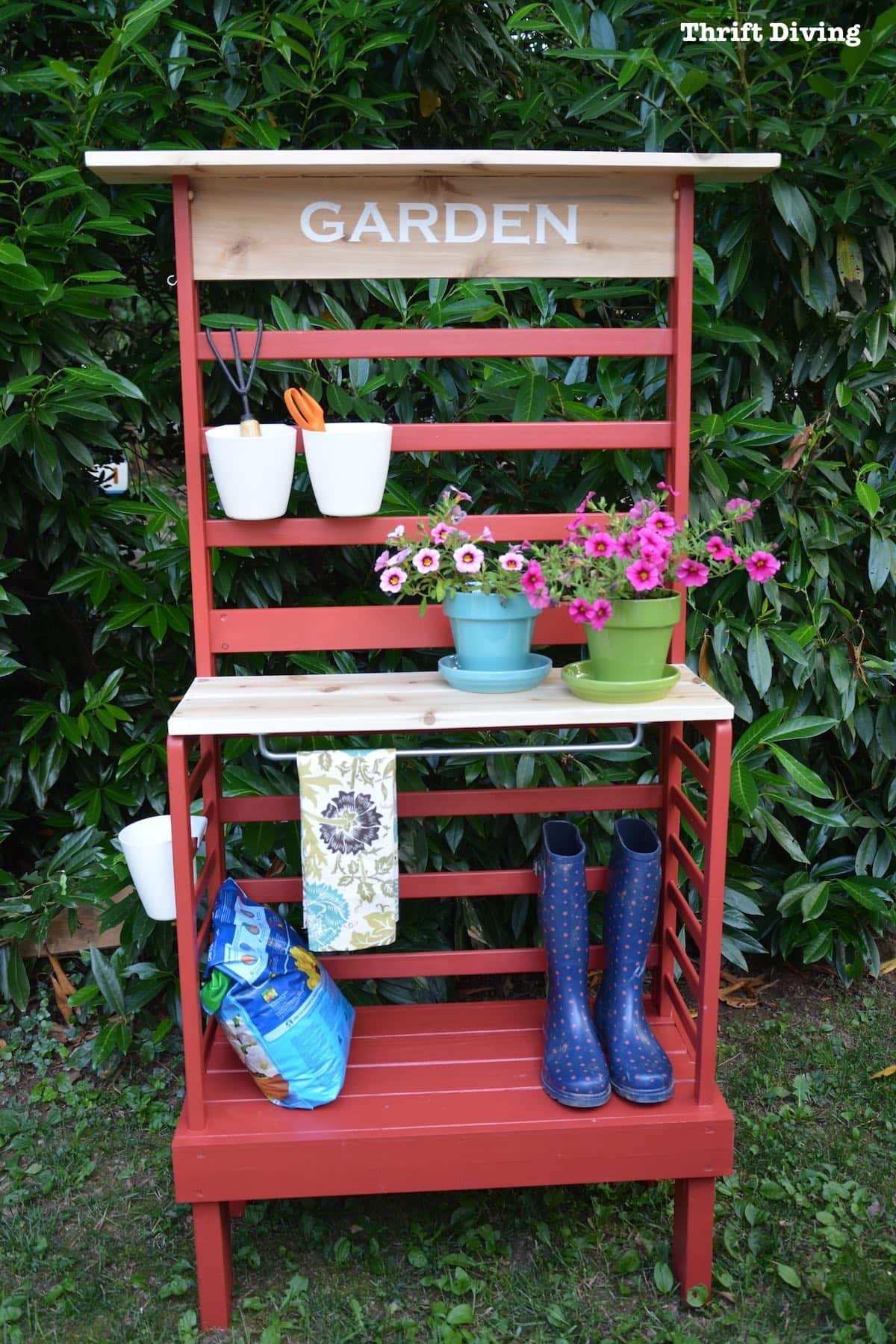 Repurposed toddler bed: What to do with an old toddler bed - Turn a toddler bed into a garden bench for your patio with storage and shelves for gardening, painted Poppy! - Thrift Diving