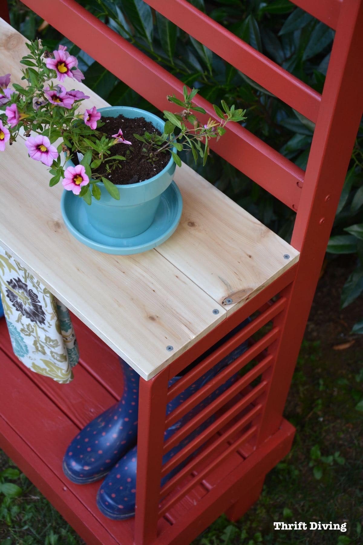 Repurposed toddler bed: What to do with an old toddler bed - Turn a toddler bed into a garden bench for your yard.- With flowers and a cedar shelf - Thrift Diving