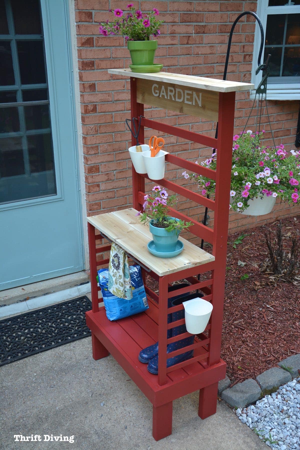 Repurposed toddler bed: What to do with an old toddler bed - Turn a toddler bed into a garden bench for your patio.- With flowers, cedar shelf, and storage. - Thrift Diving