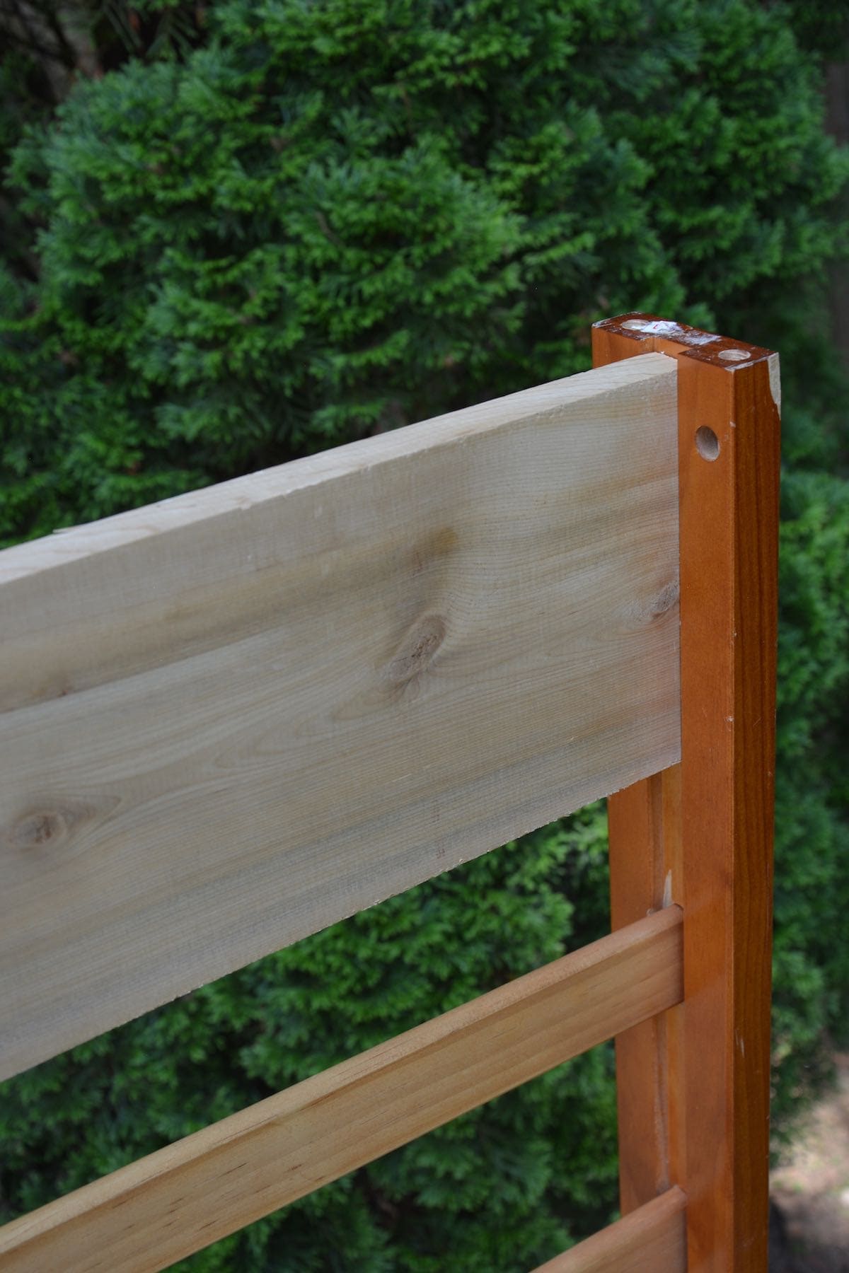 Repurposed toddler bed: What to do with an old toddler bed - Add cedar to make a DIY garden bench. - Thrift Diving