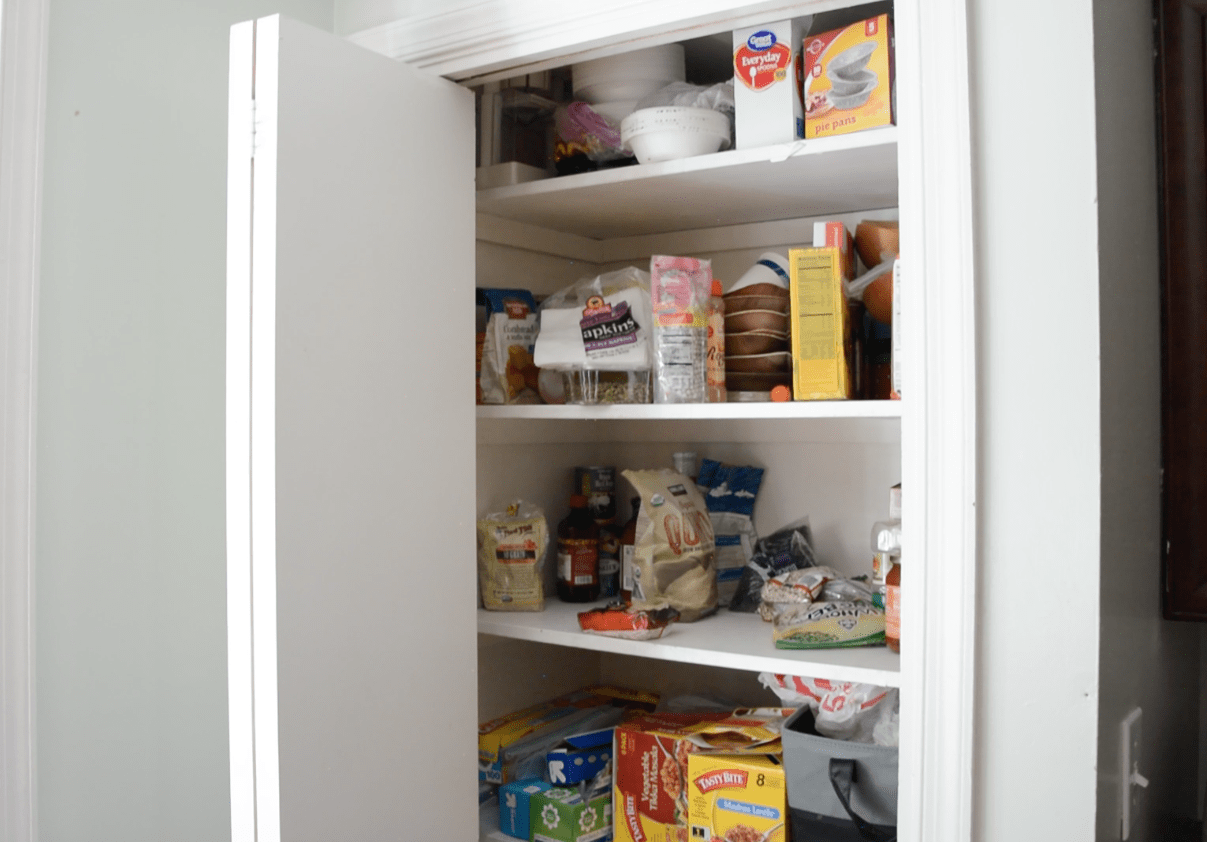 Can Food Organizer with Hidden Storage Underneath - Pantry makeover BEFORE picture in total chaos! - Thrift Diving Blog