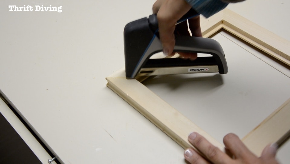 Frame Anything: How to Make DIY Picture Frames - Staple the mitered corners on the back of the picture frame to secure them. Get the tutorial! - Thrift Diving