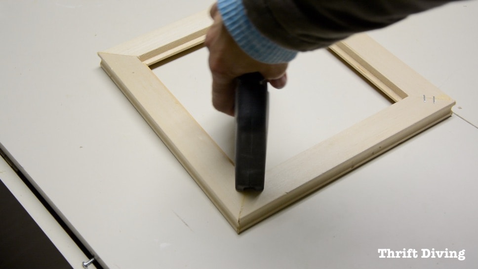 Frame Anything: How to Make DIY Picture Frames - Add a couple of staples to secure the DIY picture frame. Get the tutorial! - Thrift Diving