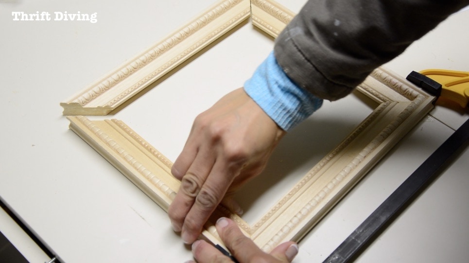 Frame Anything: How to Make DIY Picture Frames - Clamp the picture frame together while the glue dries. Get the tutorial! - Thrift Diving