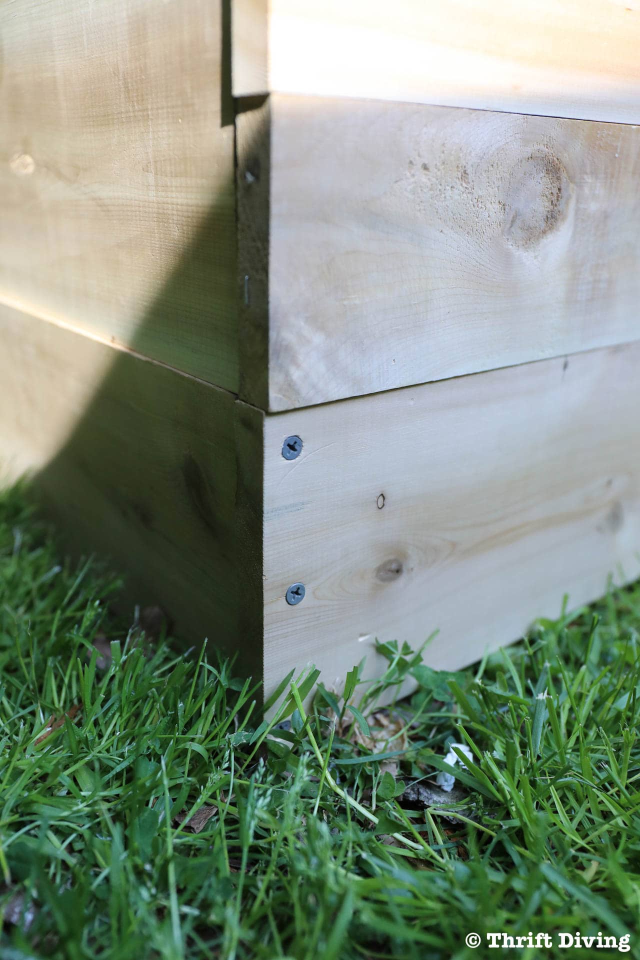 How to Build a Raised Garden Bed Protected With a Metal Fence - Create rectangular boxes to make garden beds. - Thrift Diving