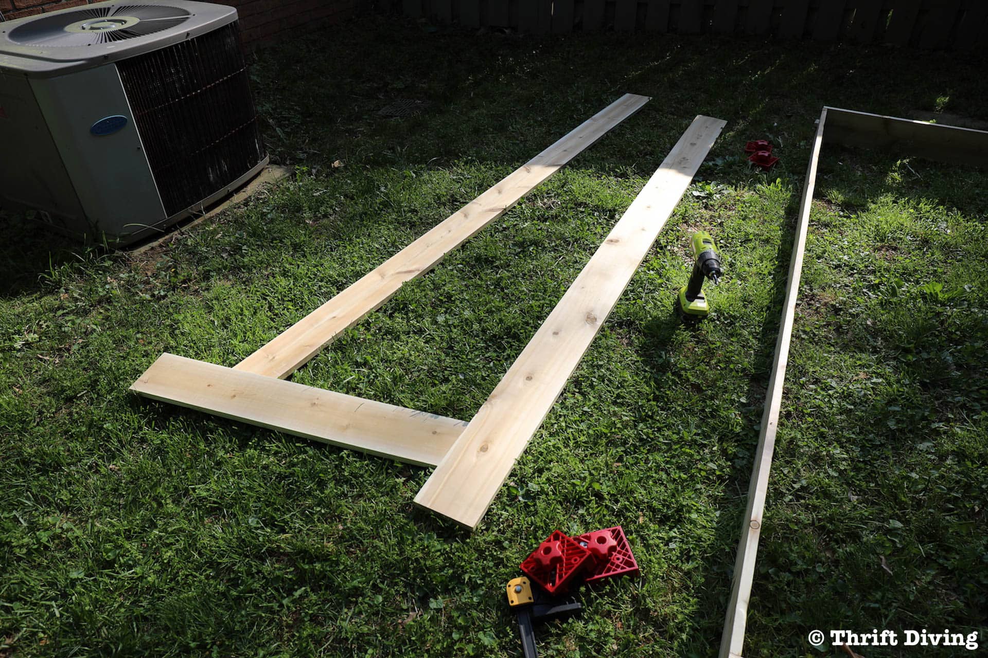 How to Build a Raised Garden Bed Protected With a Metal Fence - 4x8 is standard but these are 3x8 - Build from cedar - Thrift Diving