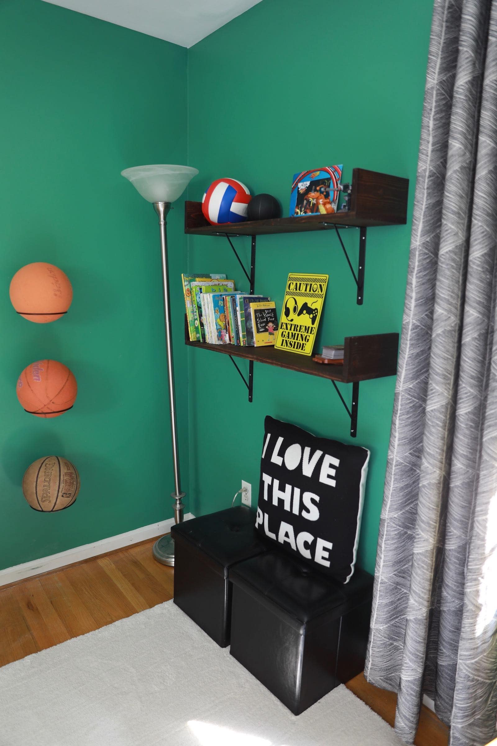 Boys green bedroom makeover - Hanging basketballs on the wall, DIY book shelves, and extra seating. - Thrift Diving