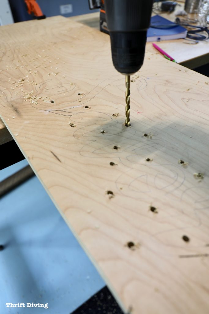 How to Make a Kitchen Sign Out of Wood: Cut pilot holes around your wood sign to make it easier to cut out the word sign. - Thrift Diving