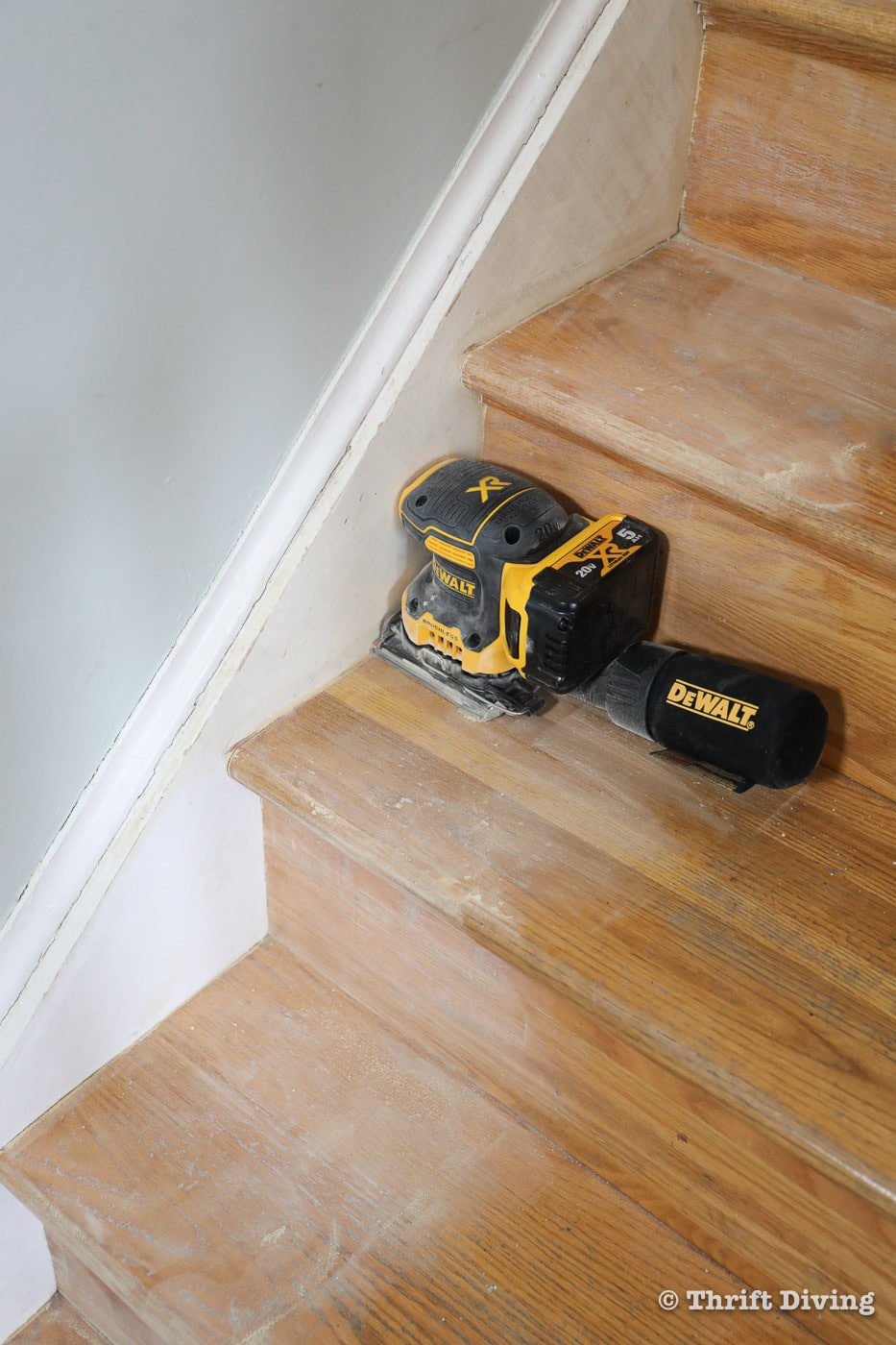 How to Install a Stair Runner - Use a sheet sander with 150-grit sandpaper to sand your stairs before priming and painting them. - Thrift Diving