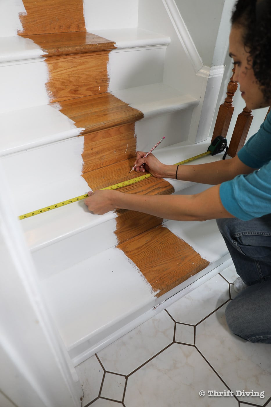 How to Install a Stair Runner - Use a pencil and tape measure to make the center of your stairs before installing rug pads and stair runner. - Thrift Diving