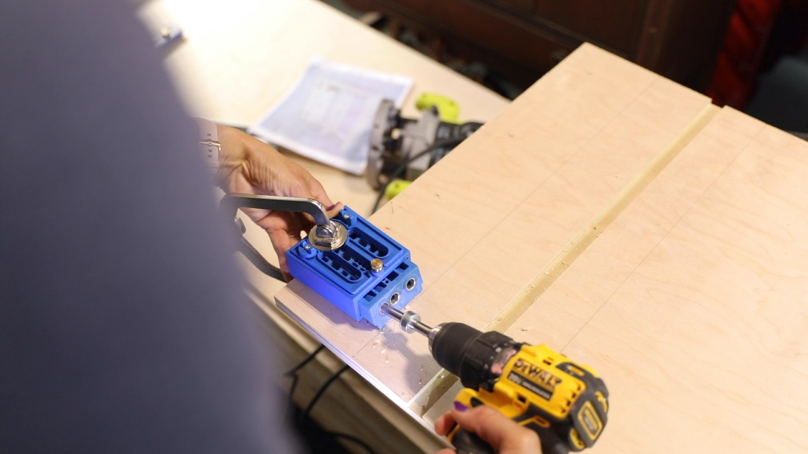 How to Build a Walk-in Closet Organizer From Scratch - Use a Kreg Pocket Hole Jig to create pocket holes for joining panels of wood. - Thrift Diving