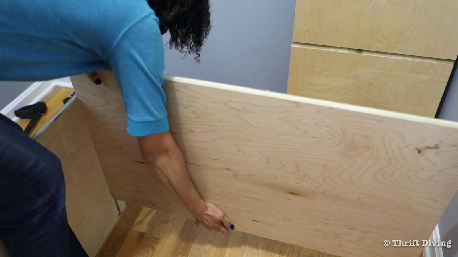 How to Build a Walk-in Closet Organizer From Scratch - Attach bottom shelf to dado with wood glue. - Thrift Diving