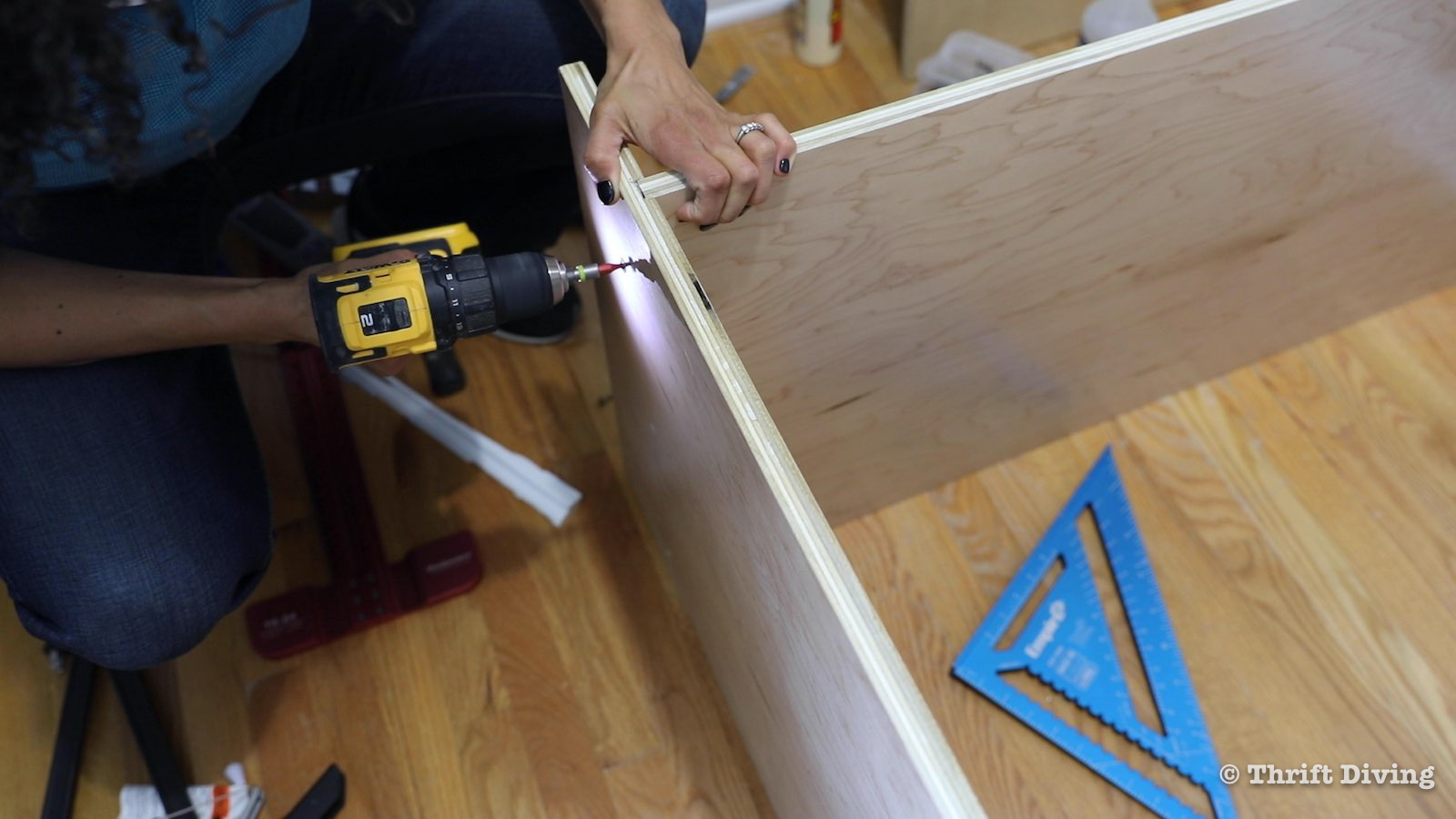 How to Build a Walk-in Closet Organizer From Scratch - Attach bottom shelf to dado with wood glue and secure with screws. - Thrift Diving