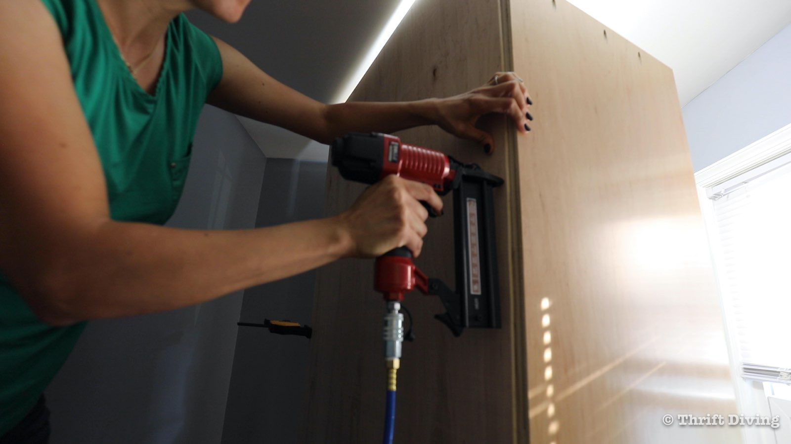 How to Build a Walk-in Closet Organizer From Scratch - Use the Arrow Fastener PT18G brad nailer to attach the back. - Thrift Diving