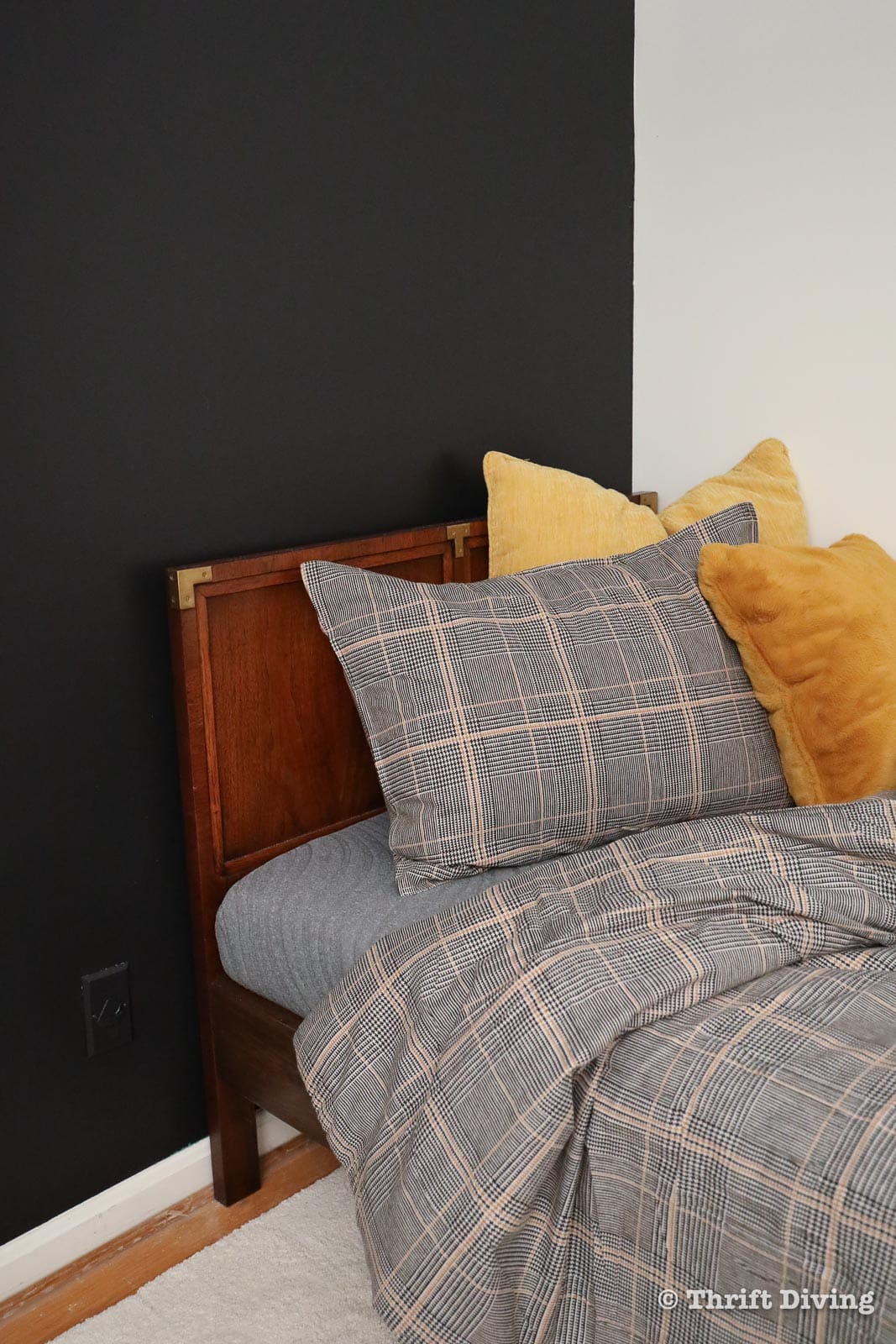 10 Lessons You MUST Learn Before Your Next Room Makeover - Boys bedroom with masculine bedding, black accent wall, gold accents. - Thrift Diving