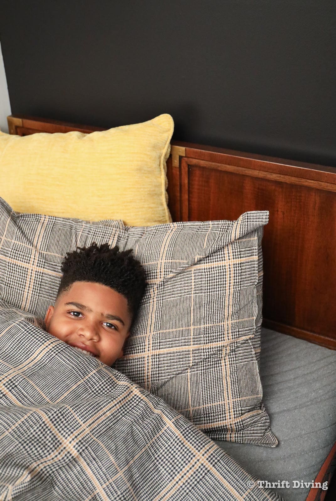 How to Build a Bed Using Vintage Headboards From the Thrift Store - Son enjoying new bed. - Thrift Diving