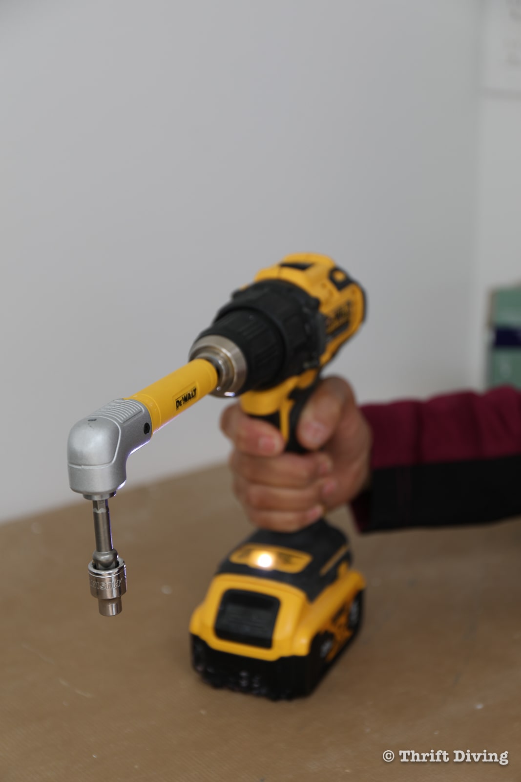Use a right angle adapter and power drill when installing clips for LED downlights - Thrift Diving