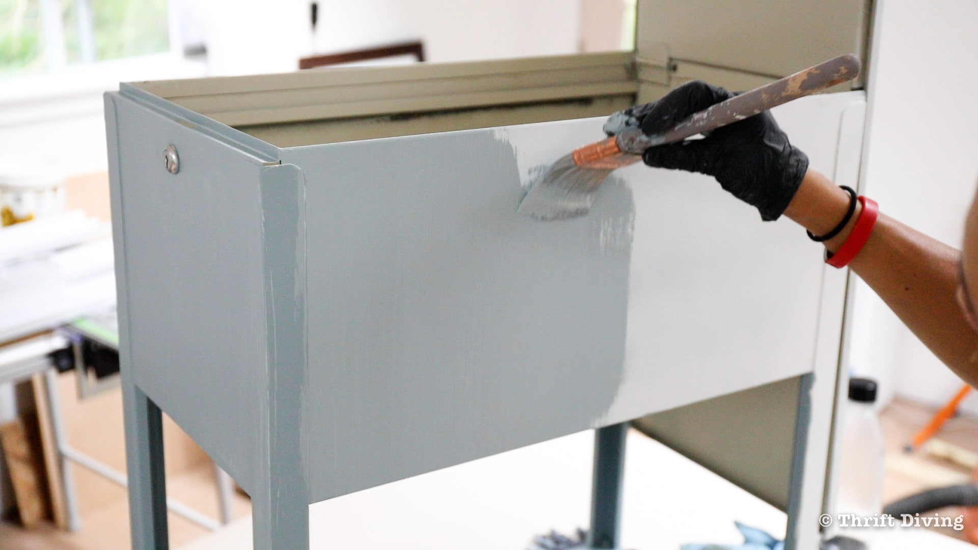 How to Paint a Metal File Cabinet - Paint the metal file cabinet with furniture paint. - Thrift Diving